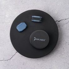 Load image into Gallery viewer, this picture shows the original jawliner 3.0 advanced with the jawliner tin on stone background