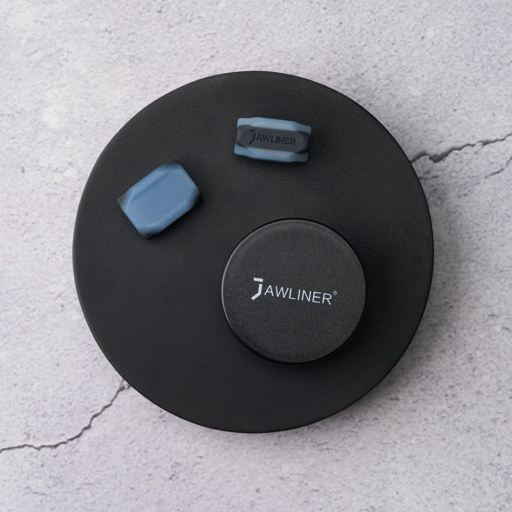 this picture shows the original jawliner 3.0 advanced with the jawliner tin on stone background